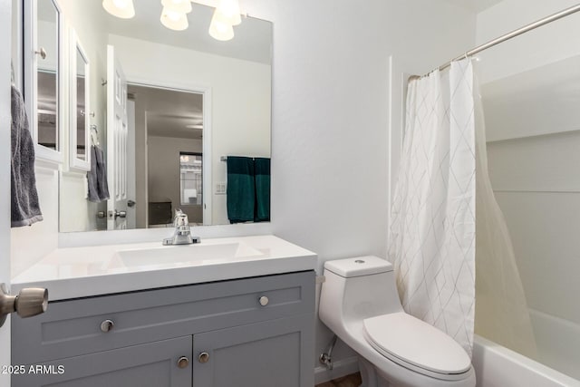 full bathroom featuring vanity, shower / bath combo, and toilet