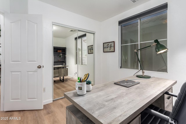 home office featuring light hardwood / wood-style floors