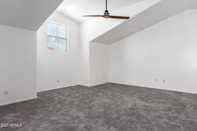 bonus room featuring dark carpet, ceiling fan, and vaulted ceiling