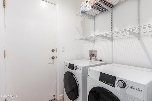 clothes washing area featuring washing machine and dryer