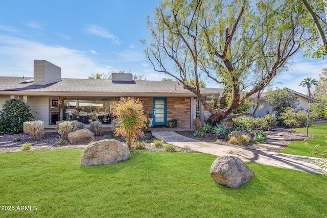 ranch-style house with a front yard