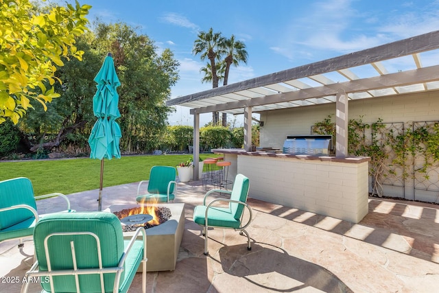 view of patio / terrace featuring area for grilling, an outdoor fire pit, exterior bar, and a pergola