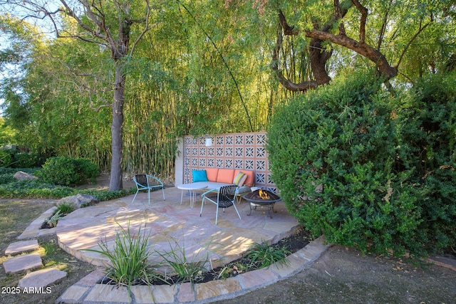 view of patio featuring a fire pit