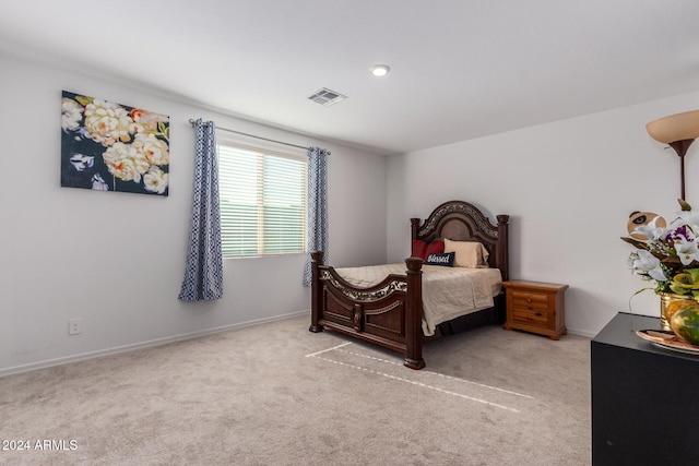 bedroom featuring light carpet