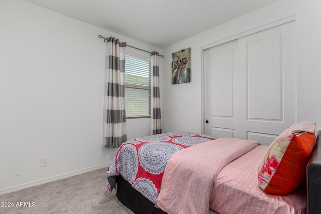 carpeted bedroom with a closet