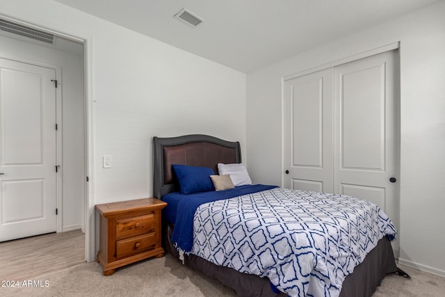 carpeted bedroom featuring a closet