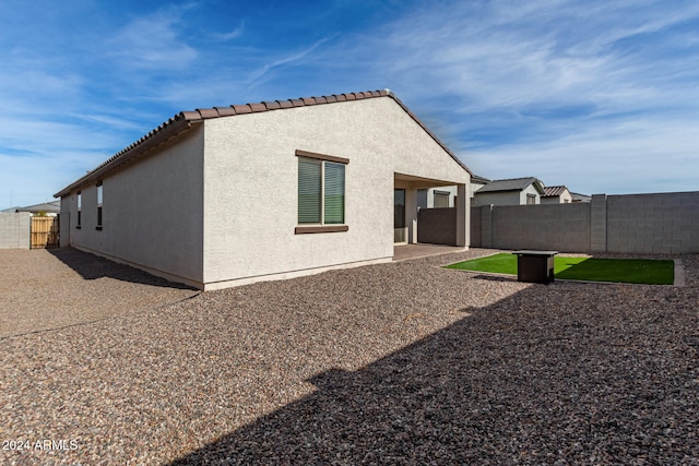 back of house featuring a patio area