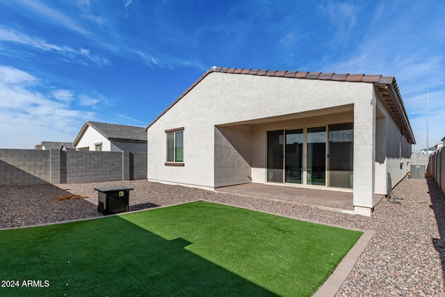 back of house featuring cooling unit