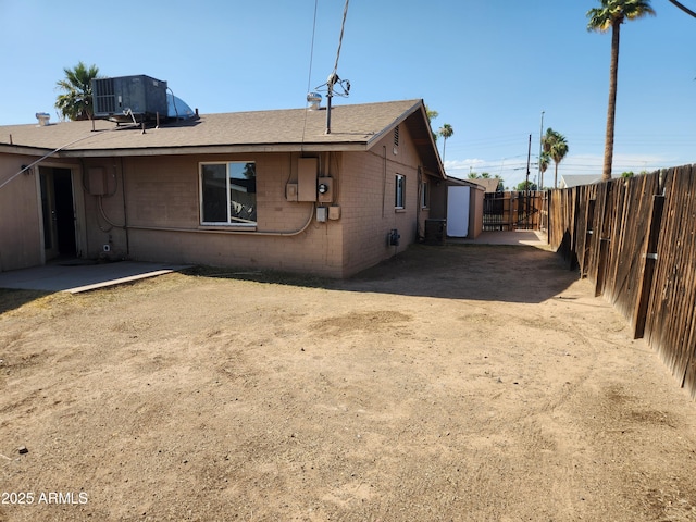 6017 W Colter St, Glendale, AZ 85301 - view of property exterior with a fenced backyard, a shingled roof, and brick siding