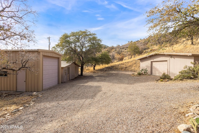 detached garage featuring a mountain view