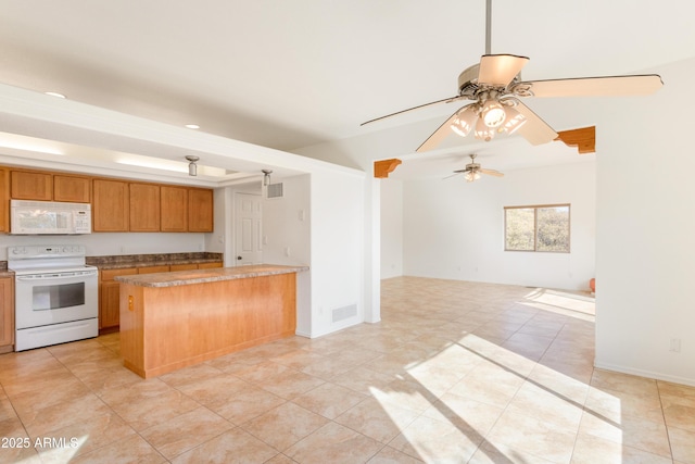 kitchen featuring light tile patterned floors, white appliances, visible vents, open floor plan, and brown cabinetry