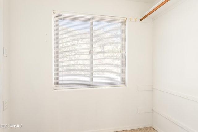 spare room featuring baseboards