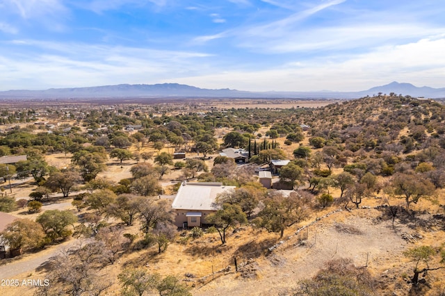 birds eye view of property with a mountain view