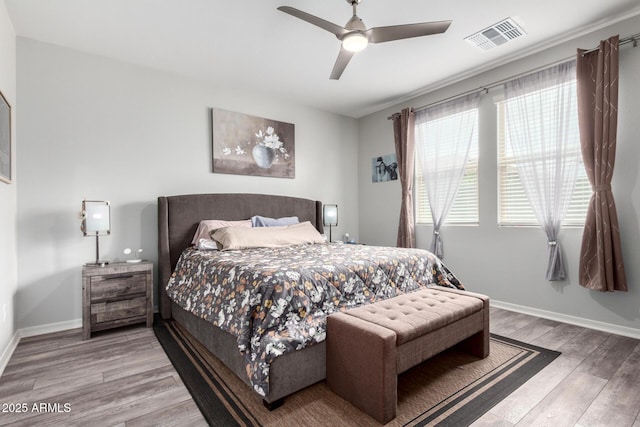 3585 W Oil Well Rd, San Tan Valley, AZ 85144 - bedroom with baseboards, visible vents, wood finished floors, and a ceiling fan