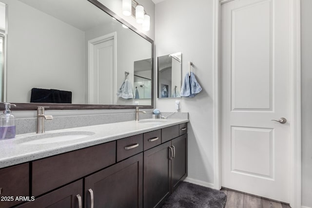 3585 W Oil Well Rd, San Tan Valley, AZ 85144 - full bath with double vanity, wood finished floors, baseboards, and a sink