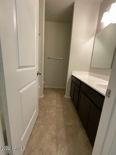 bathroom with vanity and tile flooring