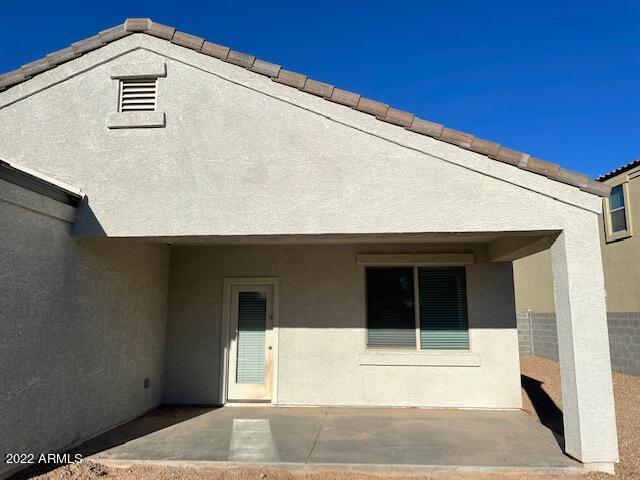 back of house with a patio