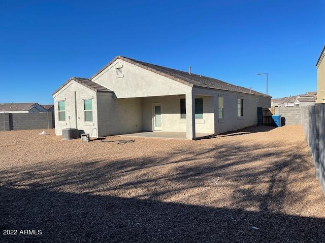 back of property with central AC unit