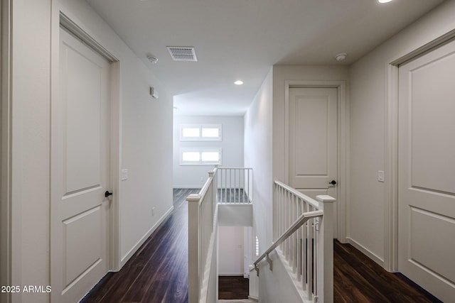 corridor featuring dark wood-type flooring