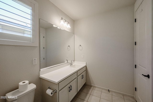 bathroom with vanity, toilet, and tile patterned flooring