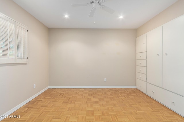 unfurnished bedroom featuring ceiling fan and light parquet floors