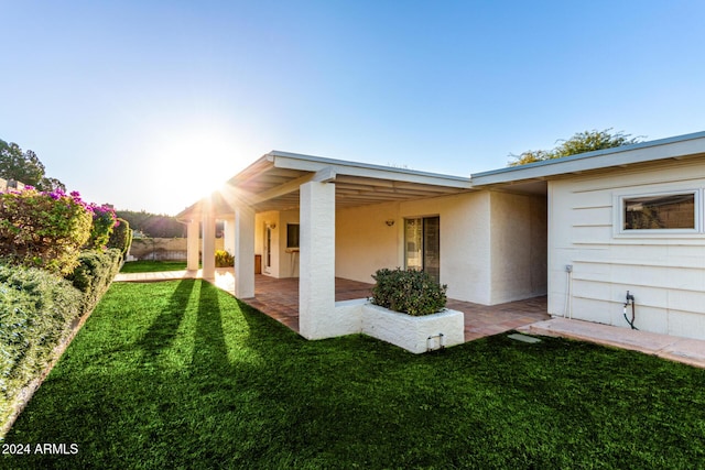 exterior space with a patio area and a yard