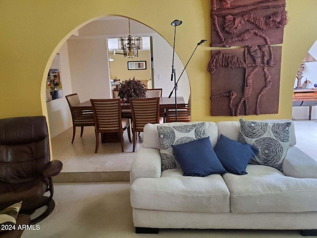 living room with a notable chandelier