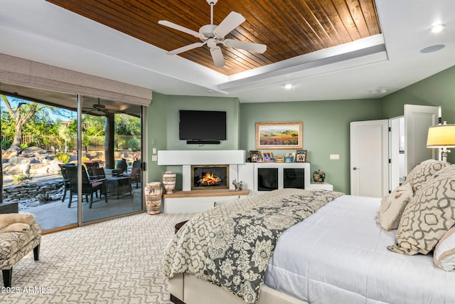 bedroom with wooden ceiling, access to exterior, and ceiling fan