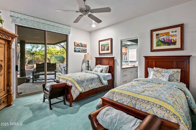 carpeted bedroom featuring ceiling fan, ensuite bathroom, and access to outside