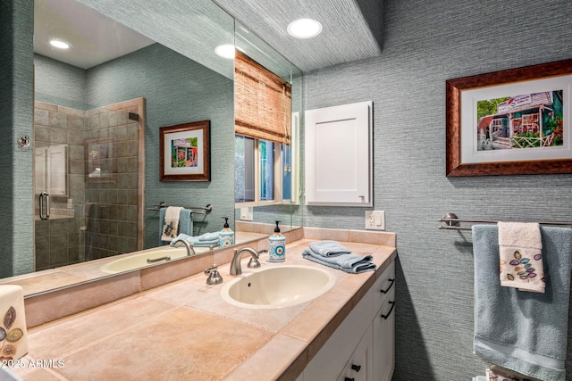 bathroom with vanity and an enclosed shower