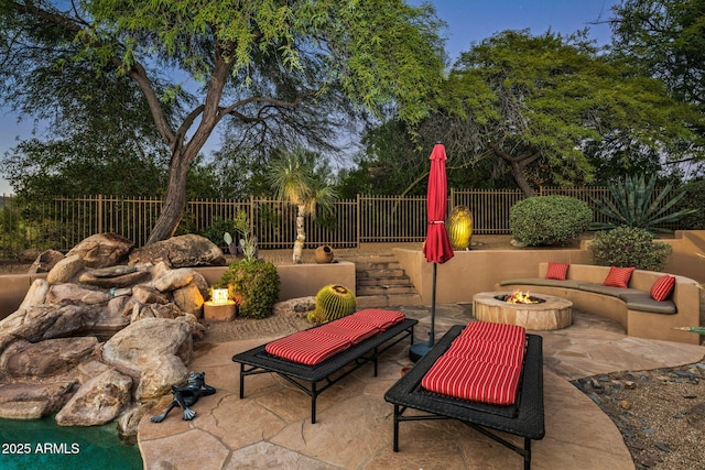 view of patio with an outdoor fire pit