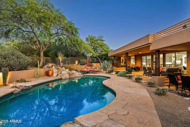 view of swimming pool featuring an outdoor living space and a patio