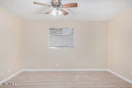 unfurnished room featuring light hardwood / wood-style flooring and ceiling fan