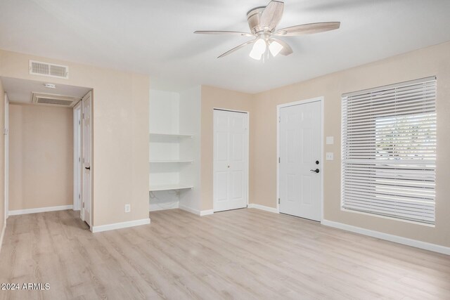 1340 N Recker Rd Unit 256, Mesa, AZ 85205 - unfurnished living room with ceiling fan, wood finished floors, and baseboards