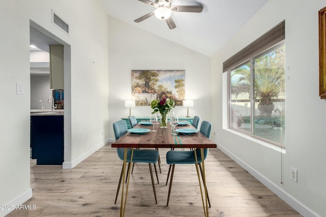 5253 E Waltann Ln, Scottsdale, AZ 85254 - dining room featuring baseboards, vaulted ceiling, a ceiling fan, light wood-style floors, and visible vents