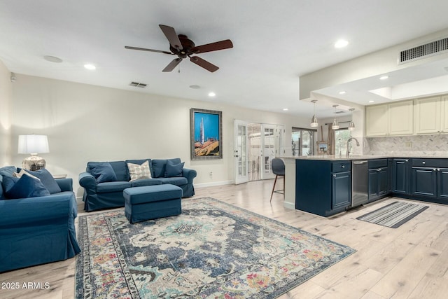 5253 E Waltann Ln, Scottsdale, AZ 85254 - living area featuring visible vents, ceiling fan, light wood-style floors, and baseboards