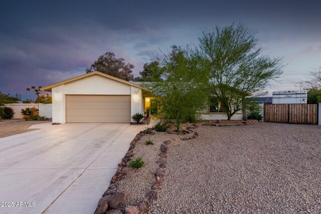 5253 E Waltann Ln, Scottsdale, AZ 85254 - view of front facade with concrete driveway, stucco siding, fence, and a garage