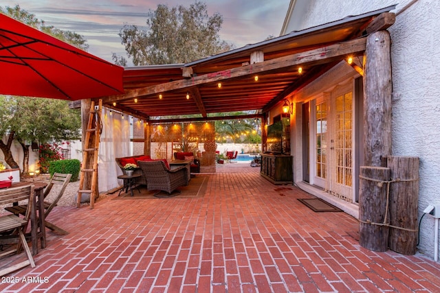 5253 E Waltann Ln, Scottsdale, AZ 85254 - patio terrace at dusk with outdoor dining space and fence