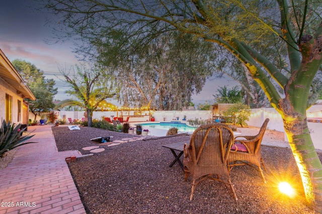 5253 E Waltann Ln, Scottsdale, AZ 85254 - yard at dusk with a fenced backyard, a fenced in pool, and a patio
