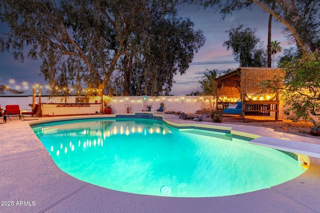 5253 E Waltann Ln, Scottsdale, AZ 85254 - pool at dusk featuring a patio area, fence, and a fenced in pool