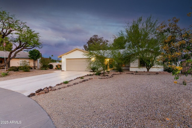 5253 E Waltann Ln, Scottsdale, AZ 85254 - view of front of property with stucco siding, a garage, and concrete driveway