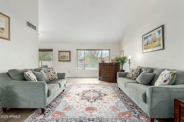 5253 E Waltann Ln, Scottsdale, AZ 85254 - living room featuring wood finished floors, high vaulted ceiling, baseboards, and visible vents