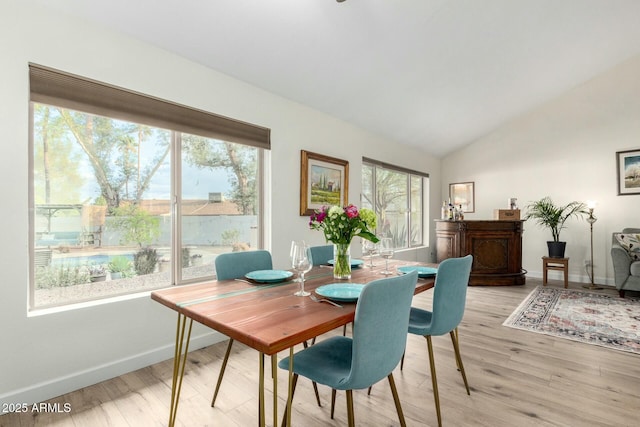 5253 E Waltann Ln, Scottsdale, AZ 85254 - dining room featuring baseboards, light wood-style floors, and vaulted ceiling