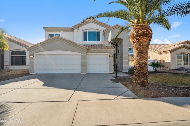 mediterranean / spanish-style home featuring a garage