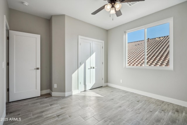 unfurnished room with light hardwood / wood-style floors and ceiling fan