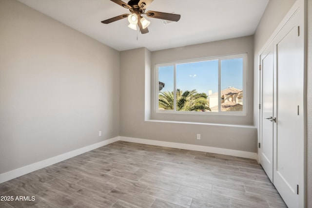 unfurnished bedroom with light hardwood / wood-style floors, a closet, and ceiling fan