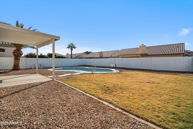 exterior space with a patio and a yard