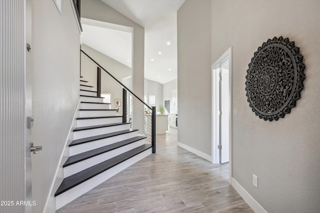 staircase featuring hardwood / wood-style floors