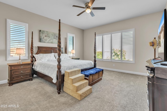 bedroom with carpet, baseboards, and a ceiling fan