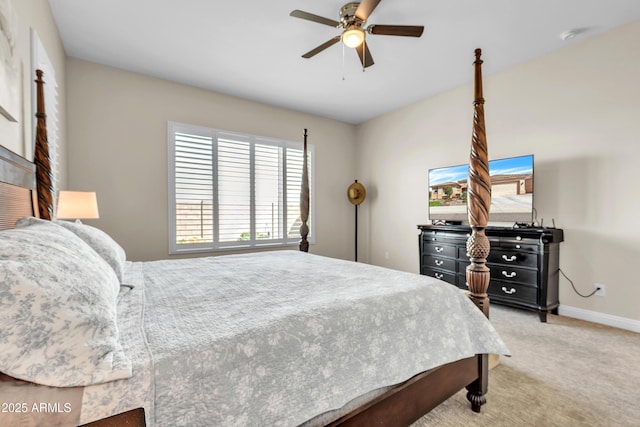 bedroom with ceiling fan, baseboards, and light colored carpet